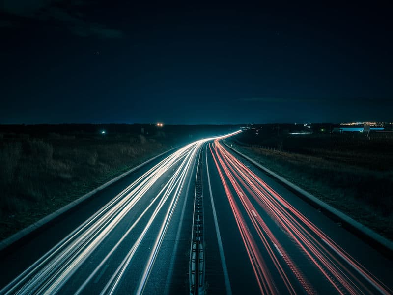 Highway with light trails at night